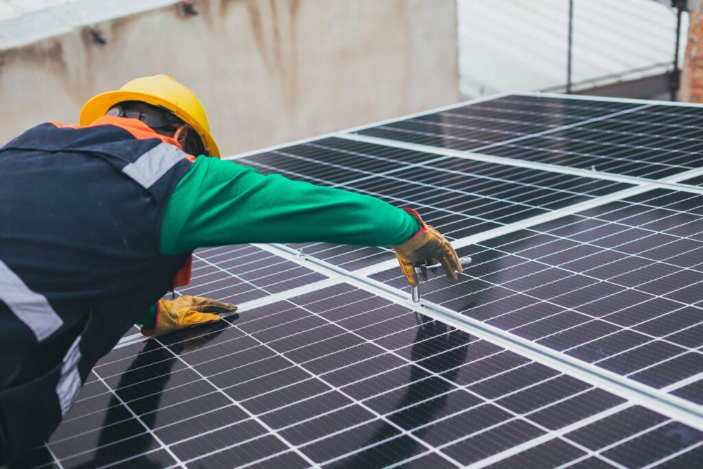 technician-installing-solar-panels